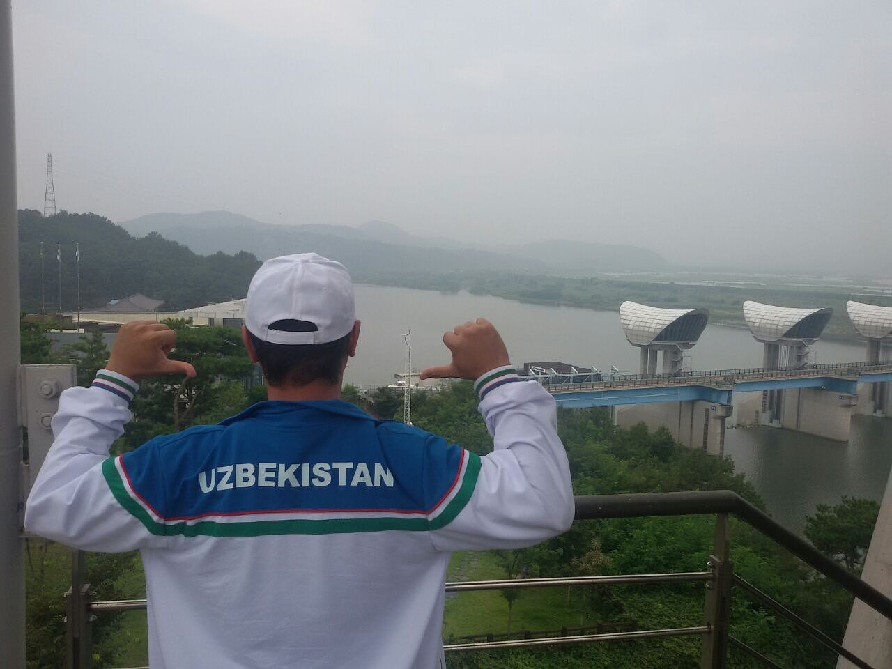Dr Khindol on a trip in Korea, wearing the Uzbekistan national team jacket